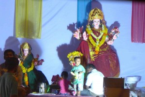 Roadside shrine to Durga, set up by neighborhood groups with local donations. There were large shrines too with long lines outside. 
