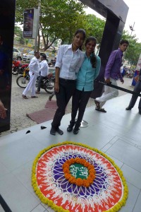 These two ladies work at the clothing store and have just completed this beautiful mandala made with flower petals and sand. Many businesses create these at the entrance for holiday blessings. 
