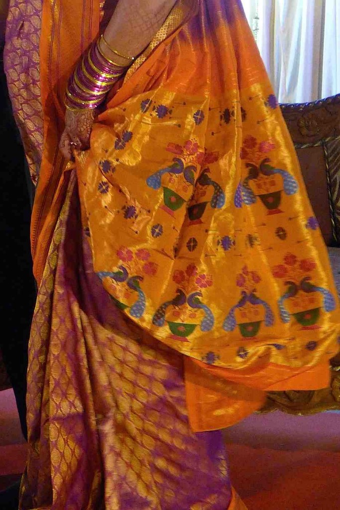The bride's handwoven silk saree at the evening reception, plus bangles.