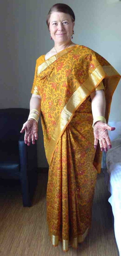 Pleats, pallu, mehndi, bindi.
